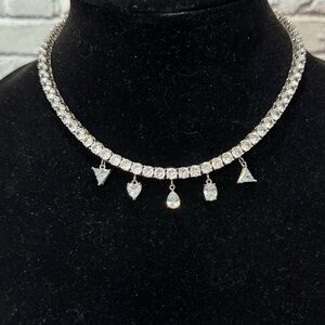 Sparkling CZ Tennis Necklace with Dangling Charms - Silver Tone ITM880